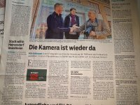 zdjęcie kolorowe na którym widać fragment gazety niemieckiej chwalącej współpracę z polską Policją